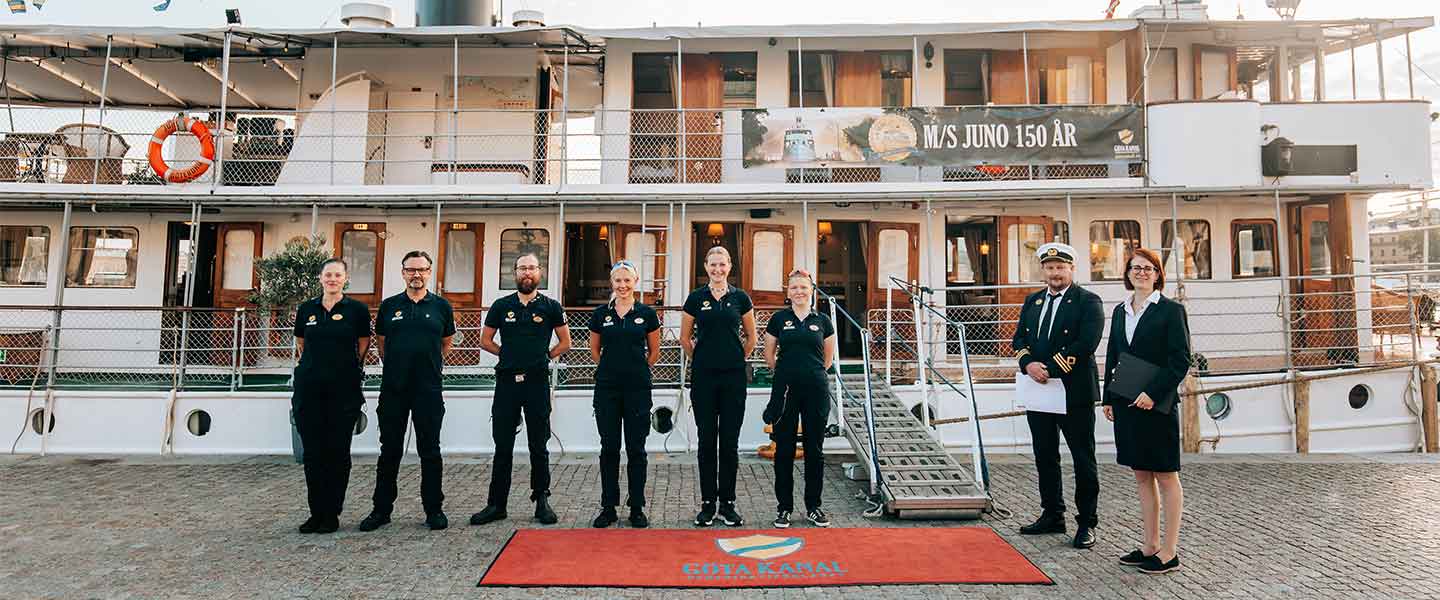 The crew on board welcoming guests upon arrival at the cruise ship.